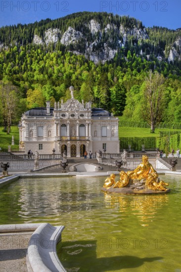 Water parterre with flora fountain and the portal of Linderhof Castle in spring, municipality of Ettal, Ammergau Alps, Ammertal, Upper Bavaria, Bavaria, Germany