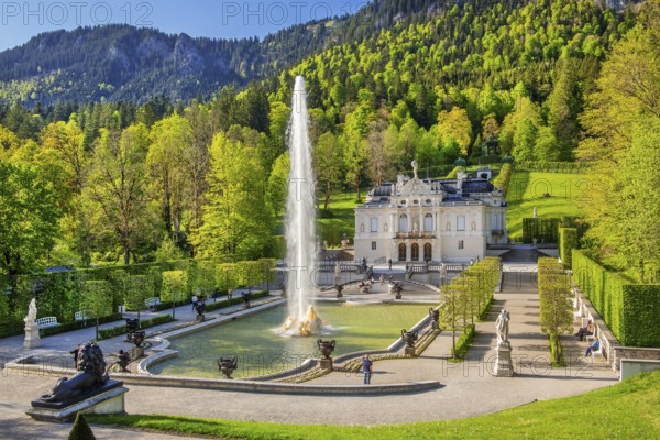 Water parterre with large fountain and portal of Linderhof Castle in spring, municipality of Ettal, Ammergau Alps, Ammertal, Upper Bavaria, Bavaria, Germany