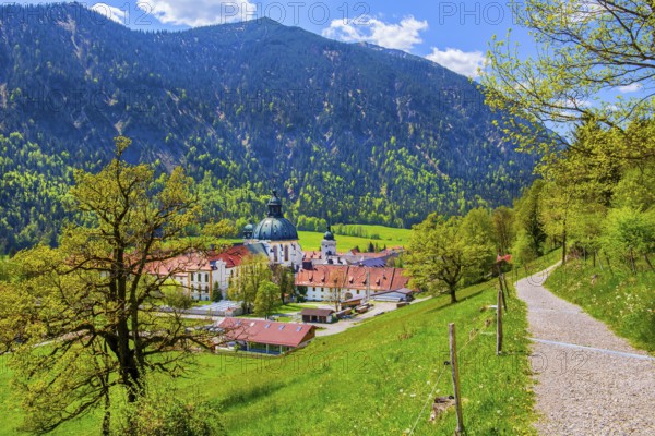 Hiking trail with Ettal Monastery in spring, municipality of Ettal, Ammergau Alps, Upper Bavaria, Bavaria, Germany