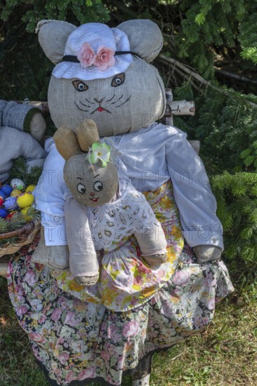 Rabbit family on a bench, Easter decoration in a village in Upper Franconia, Bavaria, Germany