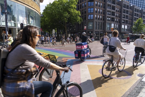 Central cycle path along the Vredenburg, in the city centre of Utrecht, lanes for pedestrians, cyclists and local traffic are separated, dense traffic, no car/truck traffic, Utrecht, Netherlands