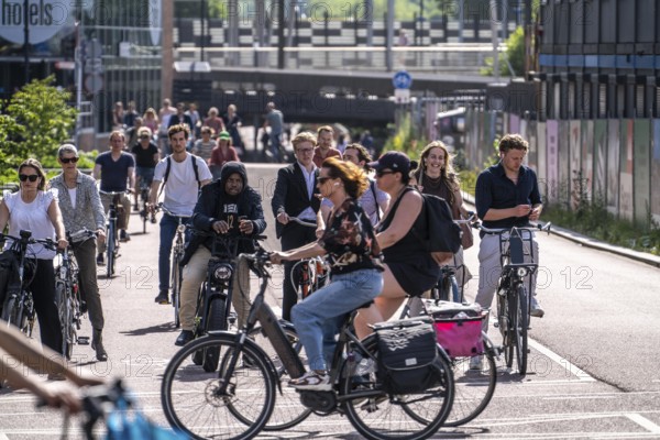 Central cycle path along the Vredenburg, behind the main station, Utrecht Centraal, in the city centre lanes for pedestrians, cyclists and local traffic are separated, dense traffic, no car/truck traffic, Utrecht, Netherlands