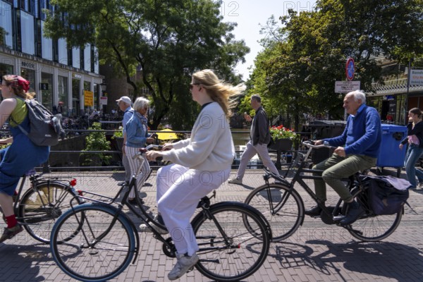 Central cycle path on the Lange Viestraat, lanes for pedestrians, cyclists and local traffic are separated in the city centre, dense traffic, no car/truck traffic, Utrecht, Netherlands