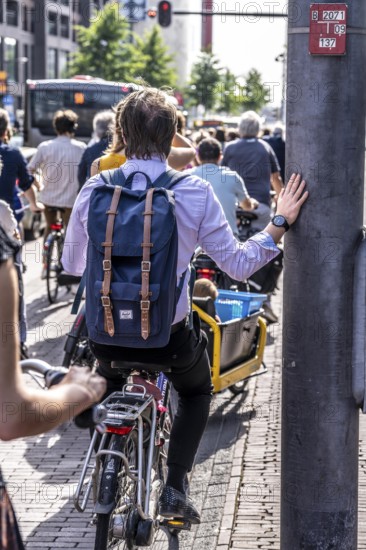 Central cycle path on the Lange Viestraat, lanes for pedestrians, cyclists and local traffic are separated in the city centre, dense traffic, no car/truck traffic, Utrecht, Netherlands