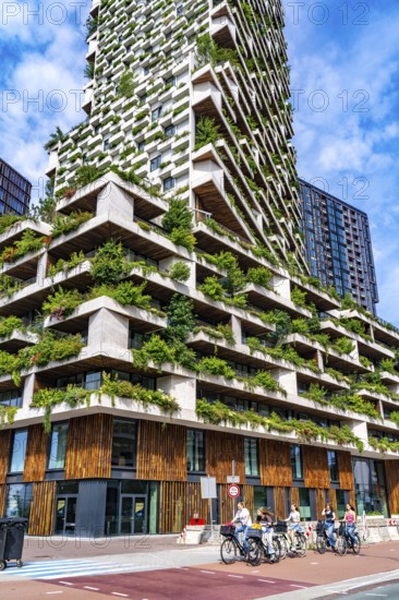 Wonderwoods residential tower, one of 2 green buildings, in Utrecht in the new Healthy Urban Quarter, at the central station, 105 metres high with 30 floors, Tower II, over 360 trees and over 9600 shrubs and flowering plants native to the region, all irrigated with collected rainwater, sponge city principle and monitored with sensors, Utrecht, Netherlands