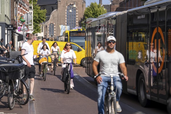 Central cycle path on the Lange Viestraat, lanes for pedestrians, cyclists and local traffic are separated in the city centre, dense traffic, no car/truck traffic, Utrecht, Netherlands