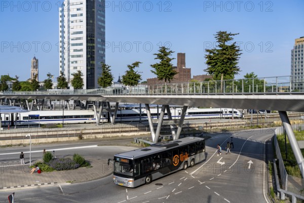 The Moreelsebrug, pedestrian and cyclist bridge over the tracks of Utrecht Centraal, Central Station, Greened with trees, ICE of the German Federal Railway on the way from Amsterdam to Germany Netherlands