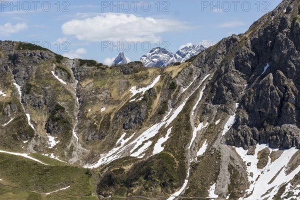 Dramatic rocky landscape with snow-capped peaks in Kleinwalsertal, Austria