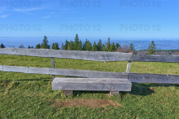 Wooden bench, on the Kandel Höhenweg, with a wide view over wooded landscape, Kandel, Waldkirch, Black Forest, Baden-Württemberg, Germany