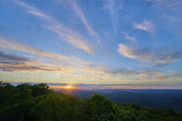 Sunset with soft colours in the sky over wooded area, Katzenbuckel, Waldbrunn, Neckar-Odenwald-Kreis, Odenwald, Baden-Württemberg, Germany
