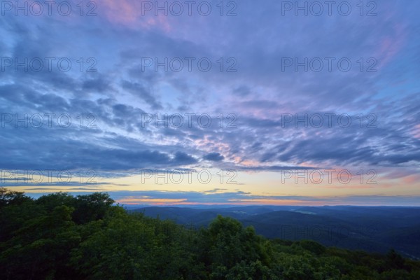 Twilight sky with purple and blue clouds over the landscape, Katzenbuckel, Waldbrunn, Neckar-Odenwald-Kreis, Odenwald, Baden-Württemberg, Germany