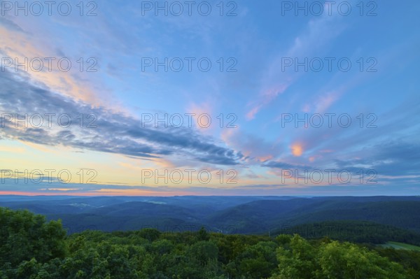 Evening light over a green landscape, Katzenbuckel, Waldbrunn, Neckar-Odenwald-Kreis, Odenwald, Baden-Württemberg, Germany