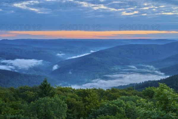 Mountain landscape with fog in the valleys at sunrise, blue sky, Katzenbuckel, Waldbrunn, Neckar-Odenwald-Kreis, Odenwald, Baden-Württemberg, Germany