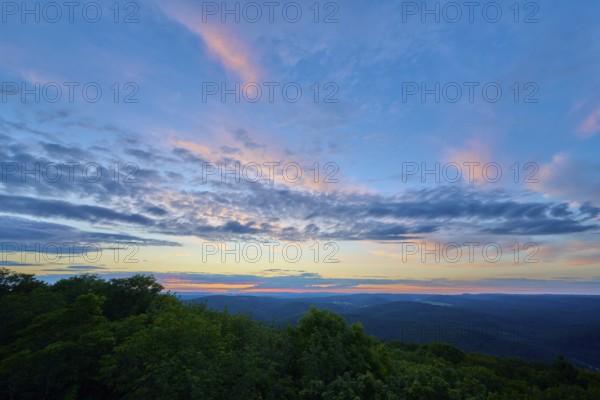 Twilight with pastel-coloured clouds over a green landscape, Katzenbuckel, Waldbrunn, Neckar-Odenwald-Kreis, Odenwald, Baden-Württemberg, Germany