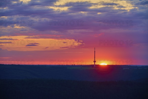 A bright sunrise with a prominent transmitter mast, Reisenbach transmitter, seen from the Katzenbuckel, Reisenbach, Mudau, Neckar-Odenwald-Kreis, Odenwald, Baden-Württemberg, Germany