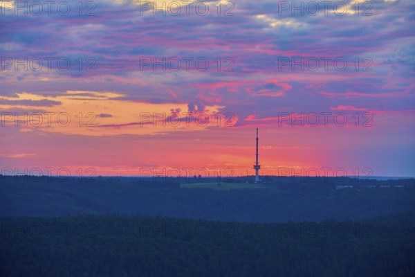 Dramatic sunrise on the horizon with a transmission mast, transmitter Reisenbach, as silhouette, seen from Katzenbuckel, Reisenbach, Mudau, Neckar-Odenwald-Kreis, Odenwald, Baden-Württemberg, Germany