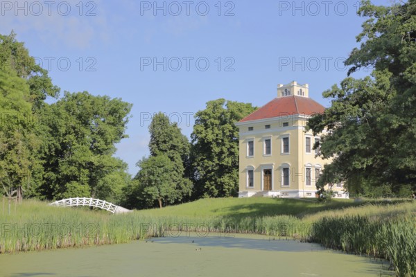 UNESCO Luisium, classicist palace with arched bridge, pond, idyll, Dessau-Wörlitz Garden Kingdom, Dessau, Dessau-Roßlau, Saxony-Anhalt, Germany