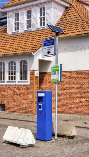 Blue parking ticket machine in the town harbour of Sassnitz, Rügen, Mecklenburg-Vorpommern, Germany
