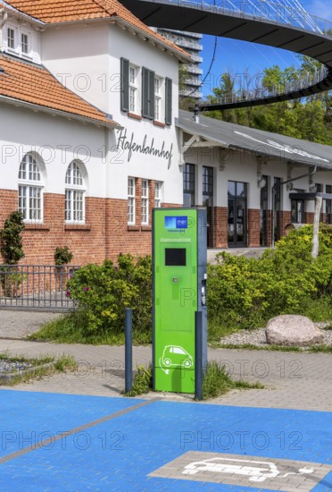 Green charging station for electromobility at the former harbour station in the city harbour of Sassnitz, Rügen, Mecklenburg-Vorpommern, Germany