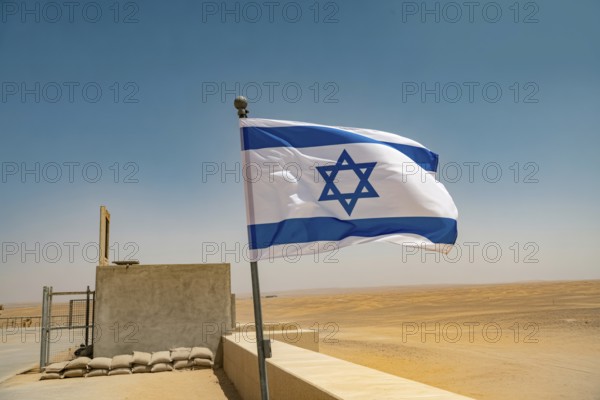 Israeli flag waving in desert wind with military checkpoint in background. Generative ai, AI generated