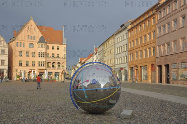 Historic houses with mood lighting on the market square, metal ball with reflection and inscription Note to link digital mobile device, Cranach-Hof, Cranachhof, Cranach-Höfe, smartphone, stainless steel, circles, lines, shiny, tourism, information, Luther city Wittenberg, Fläming, Saxony-Anhalt, Germany