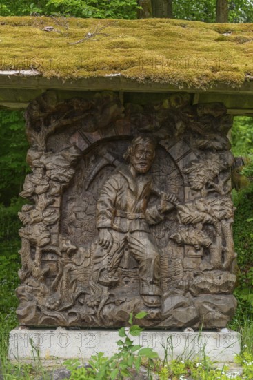 The miner from Meissner leaves the lignite tunnel, mining, GEO nature park Park Frau Holle Land am Meissner, low mountain range, legendary figure, home of the fairy tale, woodwork with ornamentation, wood sculptors Viktor and Ilja Donhauser, district of Kassel, Fulda Werra Bergland, Germany