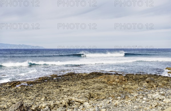 View over a rocky coast to calm broken waves, Tenerife, Canary Islands