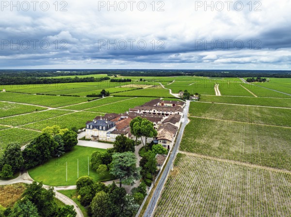 Chateau Pontet-Canet Vineyard and grape fields around Pauillac and Gironde Estuary from a drone, Bordeaux, Gironde, Nouvelle-Aquitaine, France
