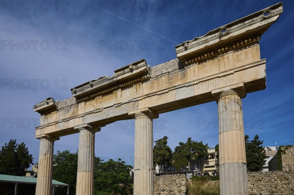 Close-up of ancient column ruins against a clear blue sky, Archaeological Site, Xysto Columned Hall, Gymnasio, Western Excavation, Kos Town, Kos, Dodecanese, Greek Islands, Greece