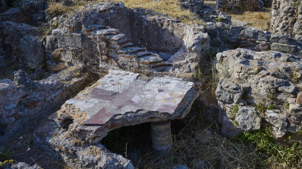 Detail of an ancient ruined site with stone structures and small staircase, Archaeological site, Floor heating, Thermal baths, Western excavation, Kos town, Kos, Dodecanese, Greek Islands, Greece