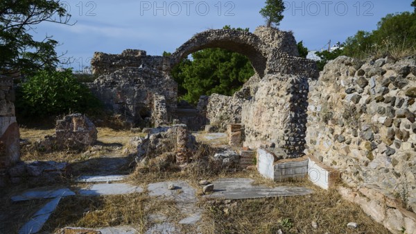 Ruins of an ancient site with stone arches and overgrown walls, Archaeological site, Western Thermae, arched ceiling, Western excavation, Kos town, Kos, Dodecanese, Greek Islands, Greece