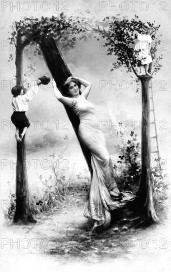 Woman lolling against a tree, 1910, Woman, surrounded by children, between stylised trees in a surreal scene, Historical photograph