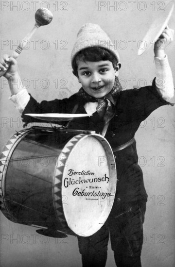 Child drum, 1920, Boy with drum and birthday wishes in a cheerful depiction, historical photo
