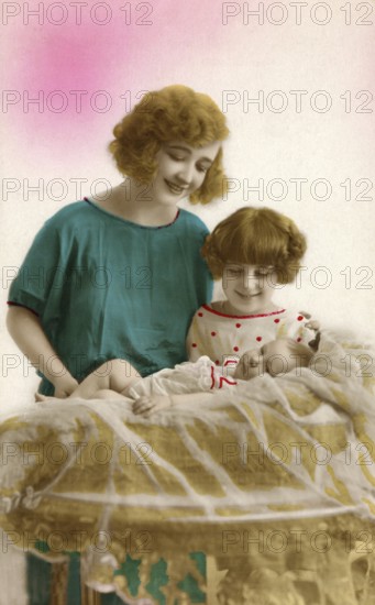 1920, Mother, child, baby, mother looking smiling at a baby in a pastel-coloured room, historical photo