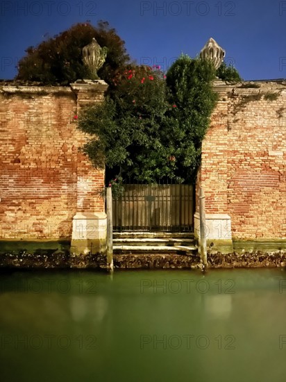 Brick wall, night shot, lagoon city of Venice, Veneto, Italy