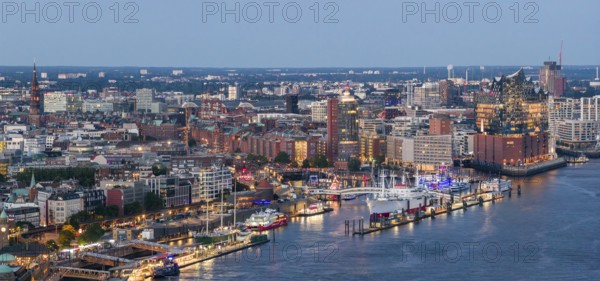 Panoramic aerial view of the Landungsbrücken in the harbour at blue hour with the Elbphilharmonie in the background, Hamburg, Germany