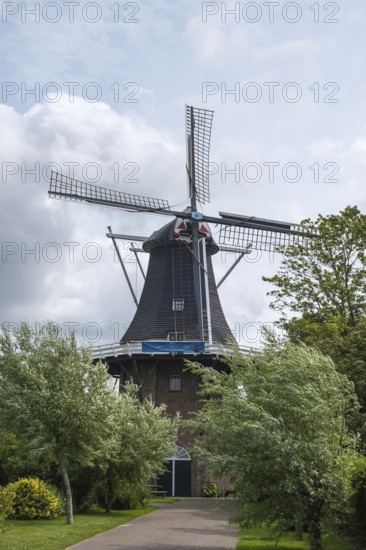 Windmill De Stormvogel (in German: The Storm Bird) octagonal tower mill, Loppersum, Eemsdelta, province of Groningen, Netherlands