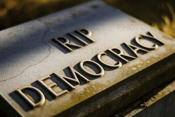 Old tombstone in ground with text RIP Democracy. Visual metaphor for the decline of democratic values. Generative AI, AI generated