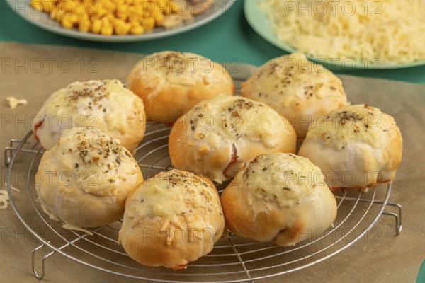 Freshly baked pizza, balls on a grid, ready to cool