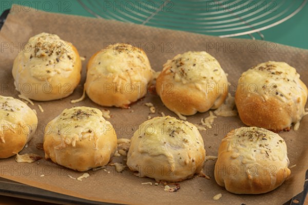 Baked pizza, balls with melted cheese, fresh from the oven