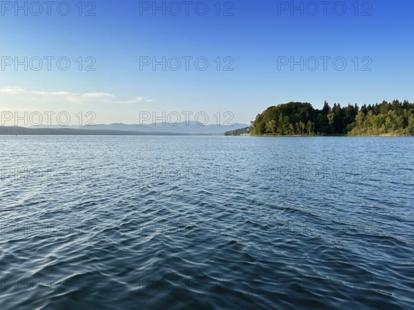 Wooded shore on Lake Starnberg with a view of the Alps, Bavaria, Germany