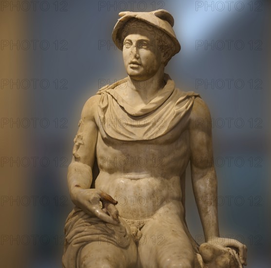 Seated marble sculpture of a man with ancient attributes such as a hat, god Hermes, classical style, Archaeological Museum, Kos Town, Kos, Dodecanese, Greek Islands, Greece