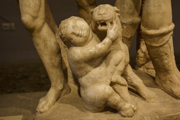 Close-up of an ancient marble sculpture of a child embracing a panther, Panther and Cupid, Archaeological Museum, Kos Town, Kos, Dodecanese, Greek Islands, Greece