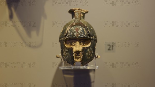 Ancient helmet, decorated, presented on a pedestal in an exhibition, depicting Hercules, Archaeological Museum, Kos Town, Kos, Dodecanese, Greek Islands, Greece