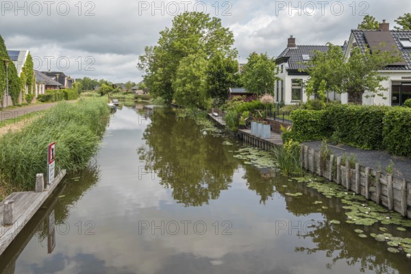 Damsterdiep canal in the village of ten Post, province of Groningen, Netherlands