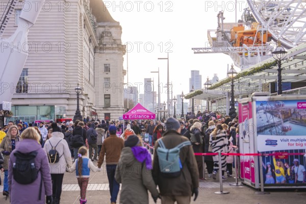 Crowd on a busy city street full of attractions and modern buildings, London, United Kingdom, World