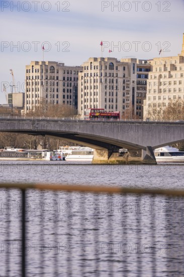 Urban scene on the river with a bridge, buildings and a bus, London, United Kingdom, World