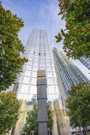 Modern skyscrapers with reflective glass facades among green trees, London, United Kingdom, World