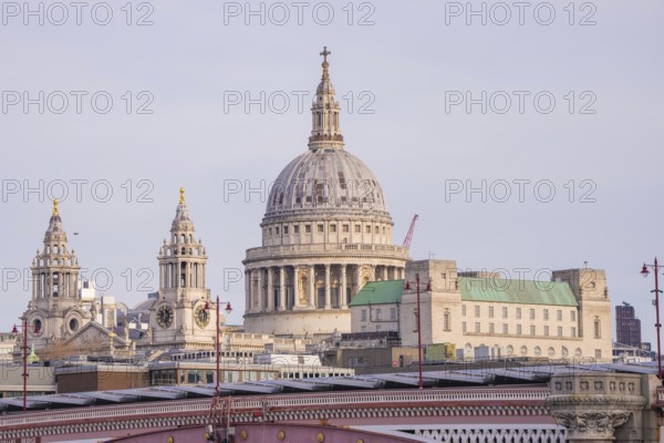 Large cathedral with a powerful dome surrounded by further towers in an urban area, London, United Kingdom, World