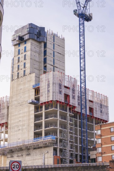 Large construction project with crane and building scaffolding in an urban area, London, United Kingdom, World